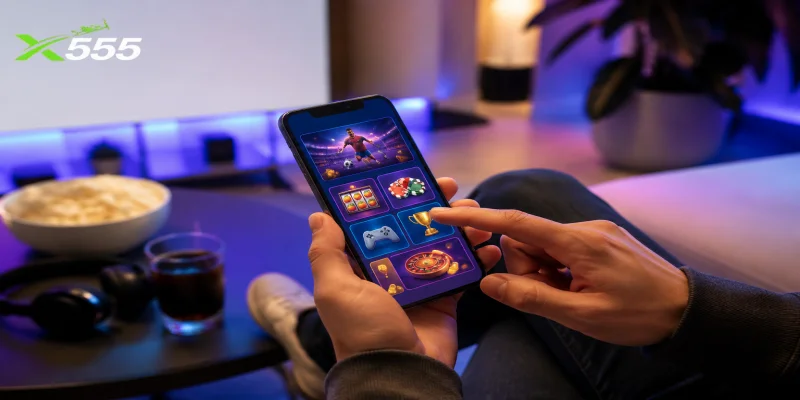 A user navigating the clean interface of the X555 Mobile Entertainment App on an Android device.